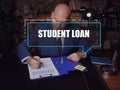 STUDENT LOAN text in block of quotes. Businessman doing paperwork StudentÃÂ debt are funds that are owed on aÃÂ loanÃÂ taken out to